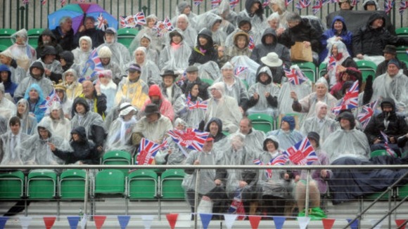 Royal revellers watch from the banks of the River Thames, during the Diamond Jubilee River Pageant.