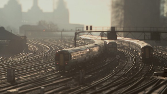 three trains passing each other on wide section of tracks