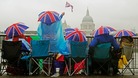Spectators watch the River Pageant as part of the Queen's Diamond Jubilee celebrations
