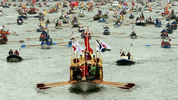 The 'Gloriana' leads the hand-powered craft past Chelsea Bridge during the Diamond Jubilee river pageant