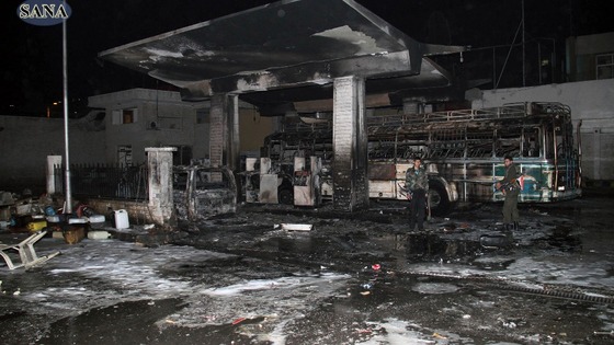 The aftermath of a car bomb that reportedly killed at least 11 people on Thursday