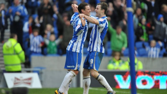 Will Hoskins is congratulated by Ashley Barnes
