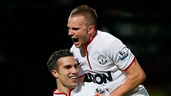 Goalscorers Robin van Persie and Tom Cleverley celebrate the late equaliser