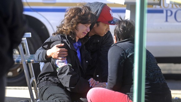 An unidentified woman is in tears following news of the hostage stand-off.