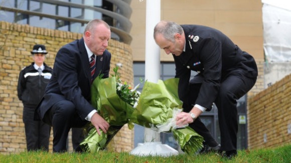 Temp Chief Constable Tim Madgwick and Mike Stubbs from the North Yorkshire Police Federation lay flowers outside Harrogate Police Station