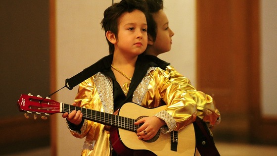 Andrejus Rascinski, aged nine, from Birmingham, waits to perform during the under-14 European Elvis Championships.