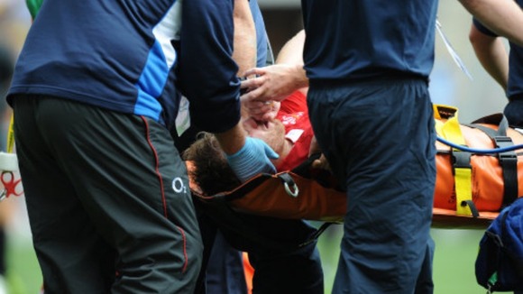 Morgan Stoddart is carried off