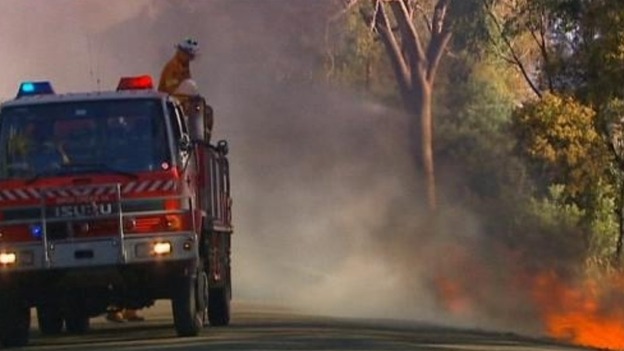 Firefighters tackle a bushfire in New South Wales, Australia
