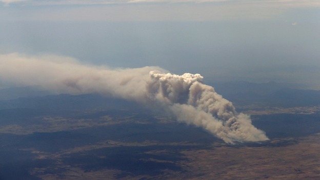 Smoke rises from the Yarrabin bushfire, burning out of control near Cooma, about 100km (62 miles) south of Canberra