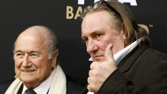 Gerard Depardieu arrives with Sepp Blatter at the Ballon d'Or gala on Monday