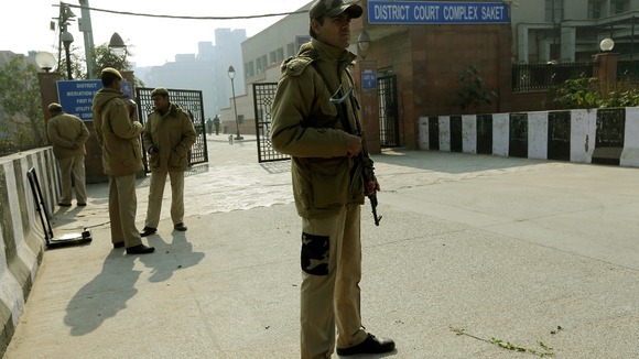 Policemen standing guard outside the court in New Delhi