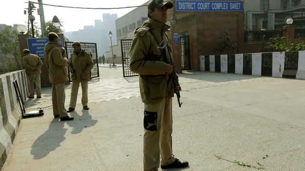 Policemen standing guard outside the court in New Delhi
