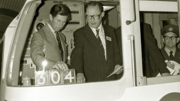 Prince Charles looks at at the controls of the driver's car of a Jubilee Line train in 1979