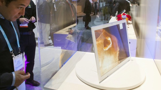 A man looks over a Panasonic 4K tablet featuring a 20-inch screen during the first day of the Consumer Electronics Show (CES) in Las Vegas 