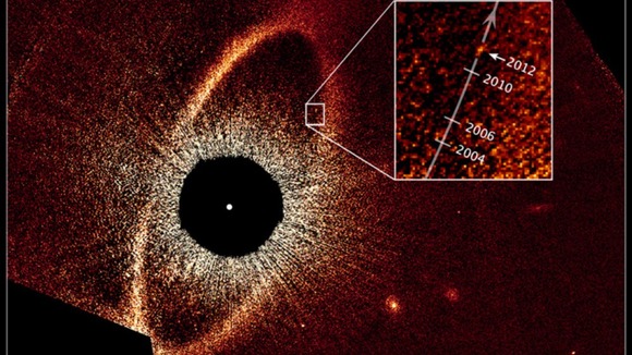 This false-colour composite image, taken with the Hubble Space Telescope, reveals the orbital motion of the planet Fomalhaut b