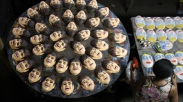 Carnival masks bearing the likeness of Brazilian soccer player Neymar, are pictured on a factory assembly line
