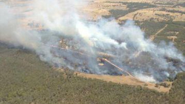 A bushfire gathers momentum to the west of Sydney.