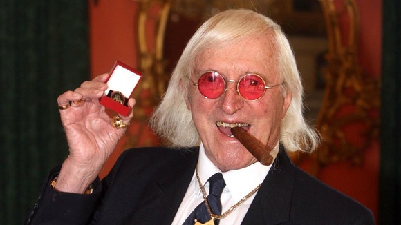 Jimmy Savile collecting an award in 2008.