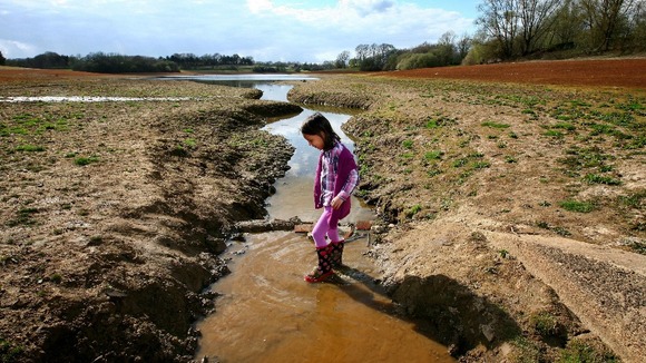 Five-year-old Isla Stanton paddling in Bewl Water Reservoir near Lamberhurst, Kent, which is currently standing at 49% of its capacity.