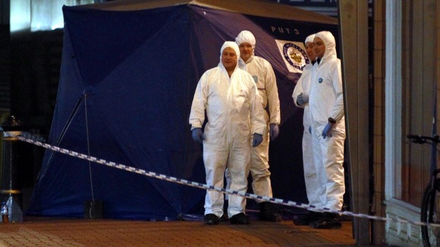 Police look for evidence at the scene of the Birmingham city centre stabbings.