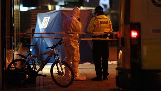 Police at the scene on Union Street in Birmingham city centre after two men were stabbed to death.