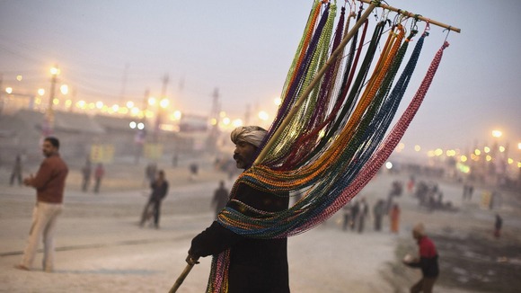 A vendor sells religious beads near banks of the River Ganges ahead of Kumbh Mela in Allahabad