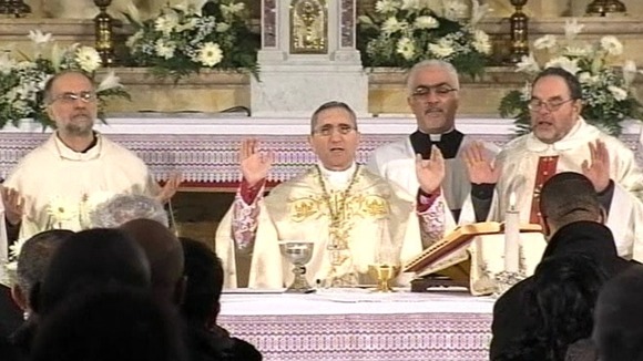 Priests holding Mass for victims of the Costa Concordia disaster