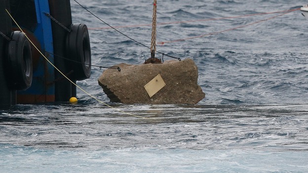 The memorial plaque affixed to the last piece of rock to be removed from the Costa Concordia.