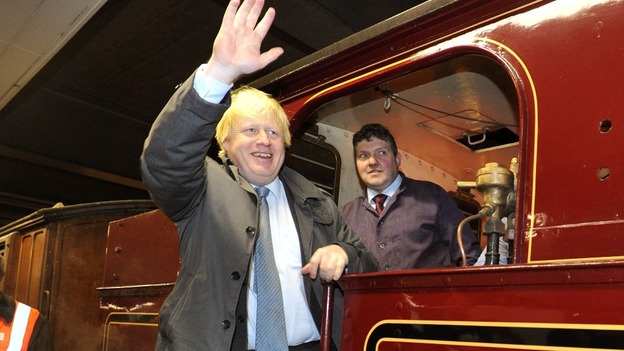 Boris Johnson, the Mayor of London, waves from aboard the 115-year-old train.