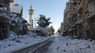 Snow covers buildings that activists say were damaged by missiles from Syrian Air Force planes in Daraya, near Camascus
