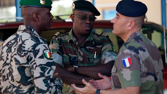 A French Army officer talks to his Malian and Senegalese army counterparts in Bamako, Mali