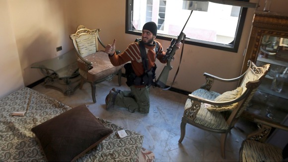 A Free Syrian Army fighter in the Ain Tarma neighbourhood of Damascus