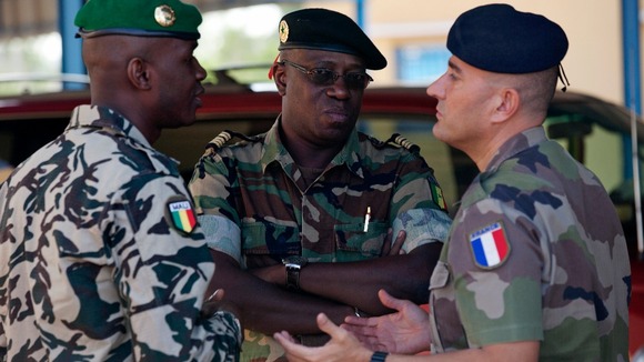 A French Army officer talks to his Malian and Senegalese army counterparts in Bamako, Mali