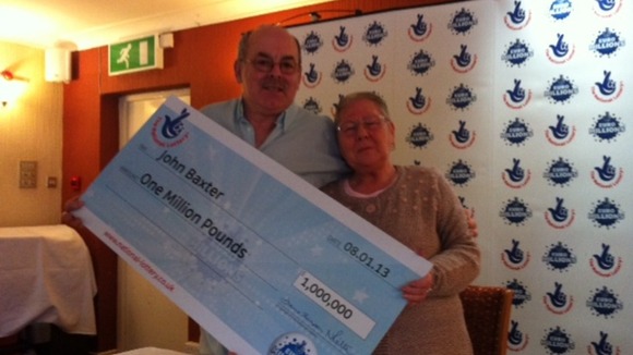 John and Carol Baxter from Baldock with their cheque