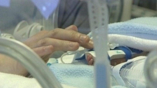 Premature baby in incubator