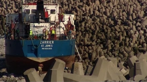 Workers on the ship grounded on rocks near Llanddulas