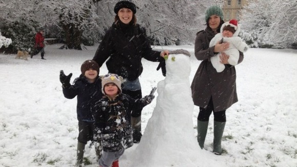 Family enjoy building snowman in Clifton  It's not all doom and gloom - family in Clifton make the most of the snow.