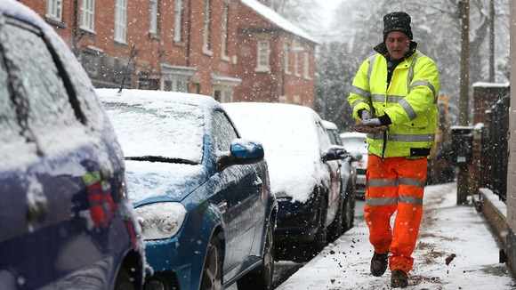 A council workers grit the pavements around Bingham, Nottinghamshire