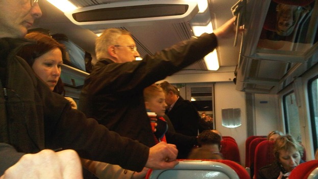 Passengers standing on train