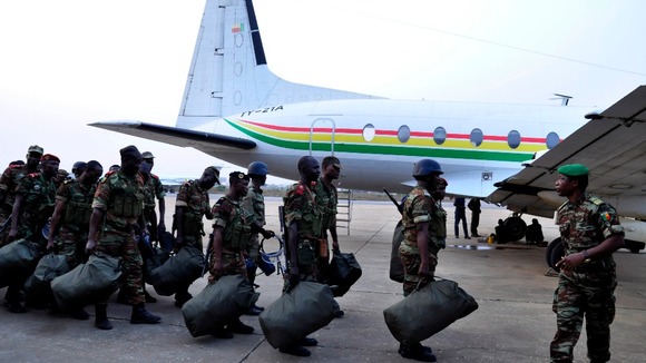 Benin soldiers line up to board a plane to Bamako, Mali