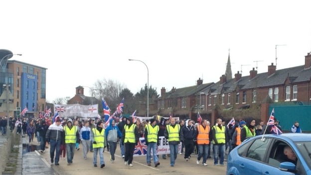 The crowd walking into Belfast City centre