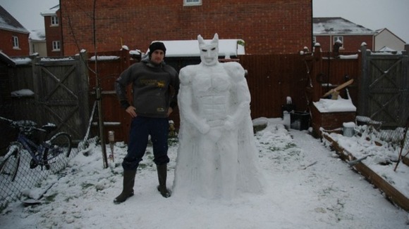 Superhero Batman is recreated in snow by Ashley and Mia Watts from Thatcham, Berkshire.