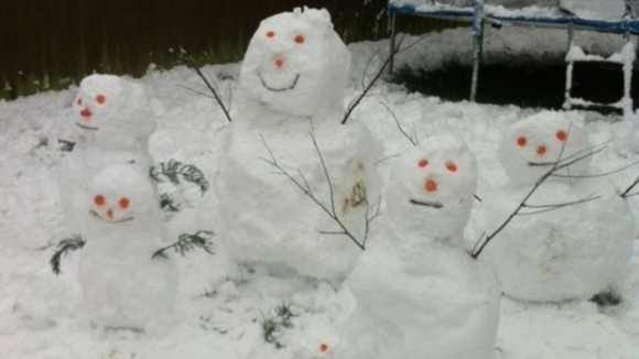 A snow family pictured in Cwmbran, Wales.