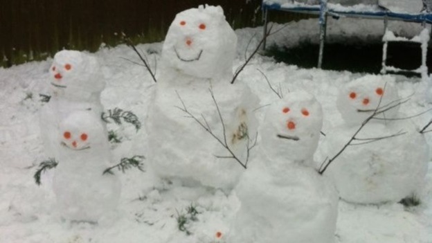 A snow family pictured in Cwmbran, Wales.