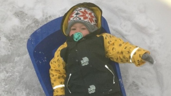 This youngster was well wrapped up and ready to sledge today.