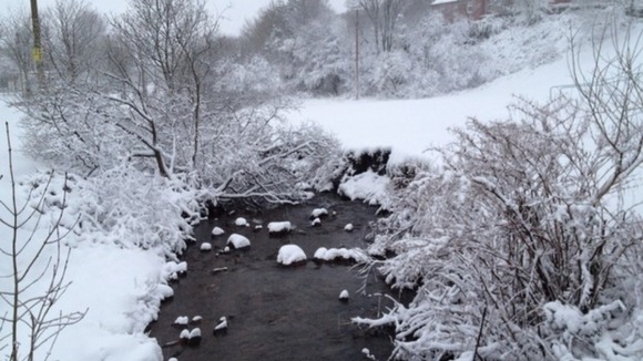 A river is glazed over with ice in Nantymoel, near Bridgend, Wales.