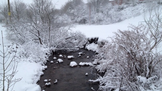 A river is glazed over with ice in Nantymoel, near Bridgend, Wales.