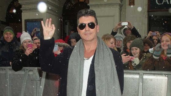 Simon Cowell waves for the cameras in London.