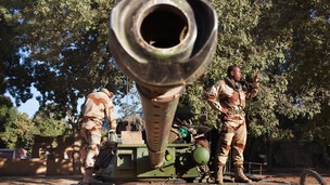 French soldiers pictured today in Niono with military weapons.