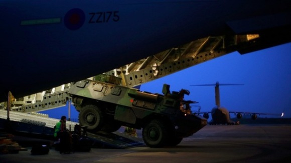 French military armoured personnel carrier is loaded on to a Royal Air Force C-17